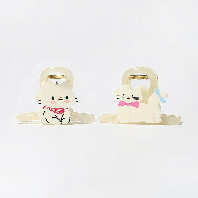 The two cat claw clip designs side by side: Milk White Scarf and Pink Blue Bow