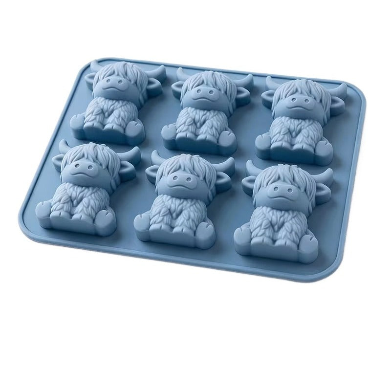 Blue 6-cow silicone mould with 6 small sitting highland cow shapes (the set includes one mould)