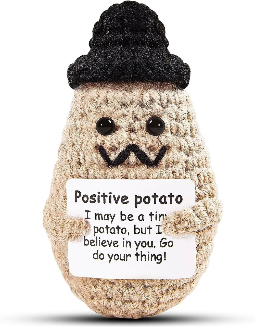 Black Hat design: khaki crochet potato doll with a black knitted hat and a moustache-style mouth, holding a small card