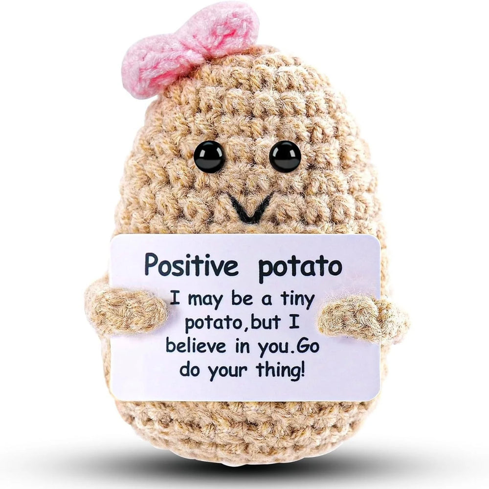 Pink Bow design: khaki crochet potato doll with a pink bow on top, holding a small card